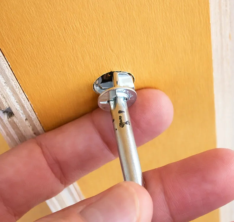 Insert lock screw with arrow towards screw.