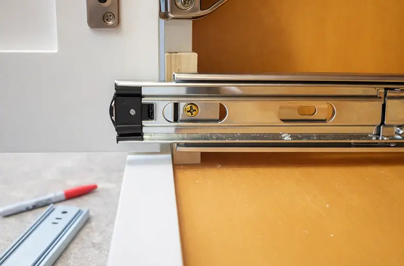 Secure the front of the glide. It will be necessary to extend the glide to expose the hole for your screw. Keep the metal a little back from front.